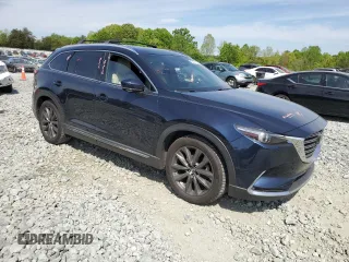 2016 Mazda CX-9 Grand Touring with VIN JM3TCBDY0G0116686, listed as a Copart auction lot 54077335 with 142,670 mi miles and Salvage title. Bid and sale history available at DreamBid. Image 4.
