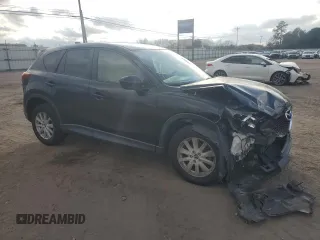 2014 Mazda CX-5 Touring with VIN JM3KE2CY9E0336218, listed as a Copart auction lot 49213255 with 124,749 mi miles and Salvage Title. Bid and sale history available at carsss.com. Image 4.