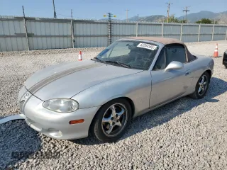 2002 Mazda MX-5 Miata Cloth with VIN JM1NB353920221183, listed as a Copart auction lot 63384585 with 212,398 mi miles and Salvage title. Bid and sale history available at DreamBid. Image 1.