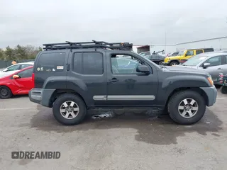 2012 Nissan Xterra S with VIN 5N1AN0NW4CC523071, listed as a IAAI auction lot 41874263 with 154,556 mi miles and . Bid and sale history available at DreamBid. Image 14.