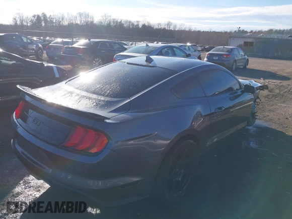 2021 Ford Mustang GT z VIN 1FA6P8CF9M5117126, wystawiony jako IAAI lot #41647619 z przebiegiem 31 076 mil mil oraz . Historia ofert i sprzedaży dostępna na DreamBid. Obrazek 4.