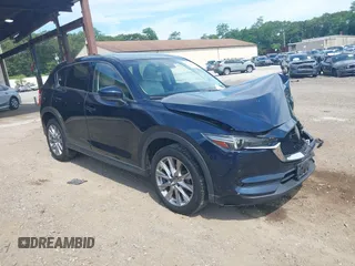 2019 Mazda CX-5 Grand Touring with VIN JM3KFBDM1K0532996, listed as a IAAI auction lot 42612645 with 89,610 mi miles and . Bid and sale history available at DreamBid. Image 1.