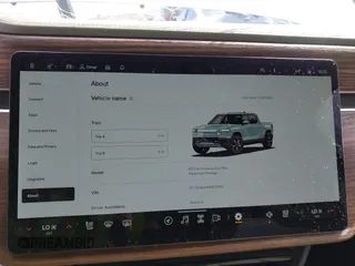 2023 Rivian R1T Adventure z VIN 7FCTGBAA9PN027894, wystawiony jako IAAI lot #42061339 z przebiegiem 5047 mil mil oraz . Historia ofert i sprzedaży dostępna na DreamBid. Obrazek 18.