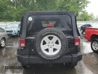 2017 Jeep Wrangler Unlimited Sport with VIN 1C4BJWDG8HL707809, listed as a Copart auction lot 57096085 with 34,959 mi miles and Salvage title. Bid and sale history available at DreamBid. Image 6.