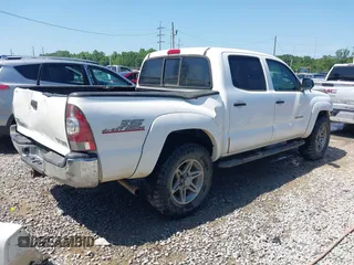 2013 Toyota Tacoma with VIN 5TFLU4EN0DX071533, listed as a IAAI auction lot 42050609 with 204,624 mi miles and . Bid and sale history available at DreamBid. Image 4.