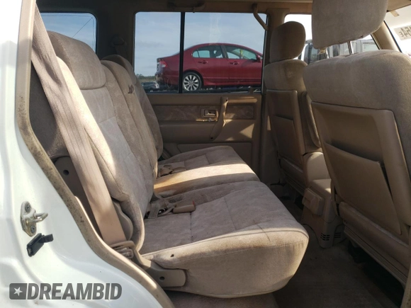 2000 Isuzu Trooper S with VIN JACDJ58X6Y7J06807, listed as a Copart auction lot 79179454 with 157,308 mi miles and Salvage title. Bid and sale history available at DreamBid. Image 11.