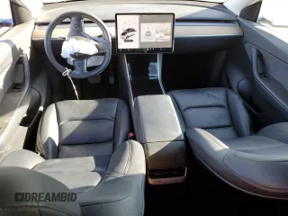 2020 Tesla Model Y Long Range with VIN 5YJYGDEE4LF015455, listed as a Copart auction lot 84223984 with 77,398 mi miles and Salvage Title. Bid and sale history available at DreamBid. Image 8.