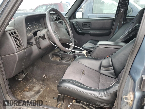 1999 Jeep Cherokee Sport with VIN 1J4FF68S4XL567848, listed as a Copart auction lot 43222045 with 280,178 mi miles and Salvage title. Bid and sale history available at DreamBid. Image 7.
