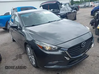 2017 Mazda 3 Touring z VIN JM1BN1V73H1101125, wystawiony jako IAAI lot #42601644 z przebiegiem 119 291 mil mil oraz . Historia ofert i sprzedaży dostępna na DreamBid. Obrazek 1.