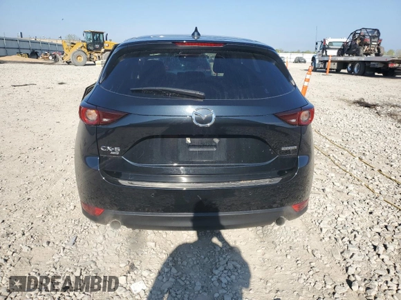 2021 Mazda CX-5 Touring z VIN JM3KFBCM5M0471172, wystawiony jako Copart lot #56646065 z przebiegiem 42 843 mil mil oraz Szkody całkowita. Historia ofert i sprzedaży dostępna na DreamBid. Obrazek 6.