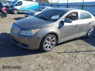 2012 Buick LaCrosse Convenience with VIN 1G4GB5E32CF275083, listed as a IAAI auction lot 41020528 with 148,082 mi miles. Bid and sale history available at carsss.com. Image 2.
