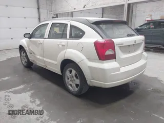 2009 Dodge Caliber SXT with VIN 1B3HB48A19D212690, listed as a IAAI auction lot 42076527 with 212,909 mi miles and . Bid and sale history available at carsss.com. Image 3.