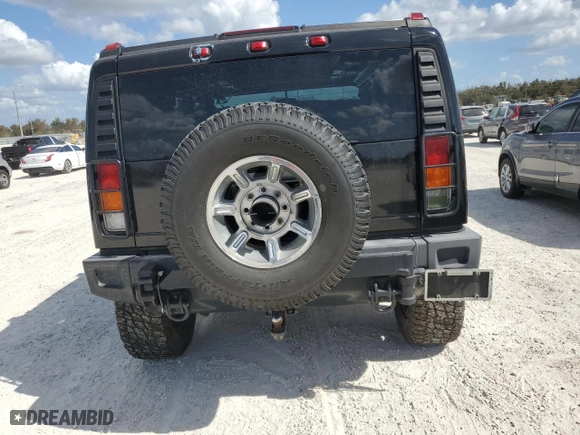2003 Hummer H2 with VIN 5GRGN23U33H102570, listed as a Copart auction lot 77259654 with 0 mi miles and Salvage Title. Bid and sale history available at carsss.com. Image 6.