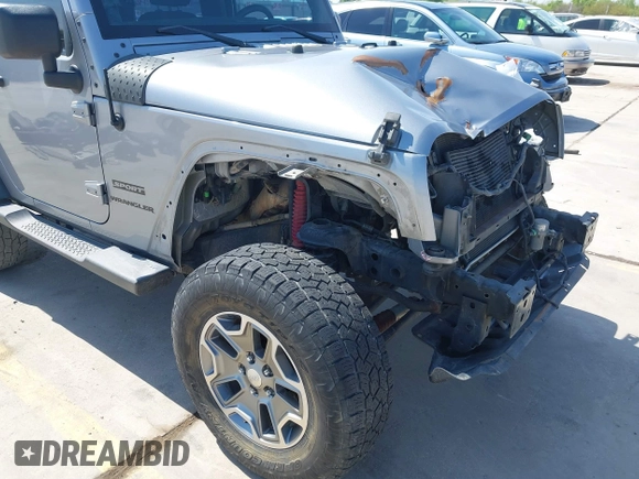 2014 Jeep Wrangler Sport with VIN 1C4AJWAG9EL155409, listed as a IAAI auction lot 41869906 with 102,400 mi miles and . Bid and sale history available at carsss.com. Image 18.
