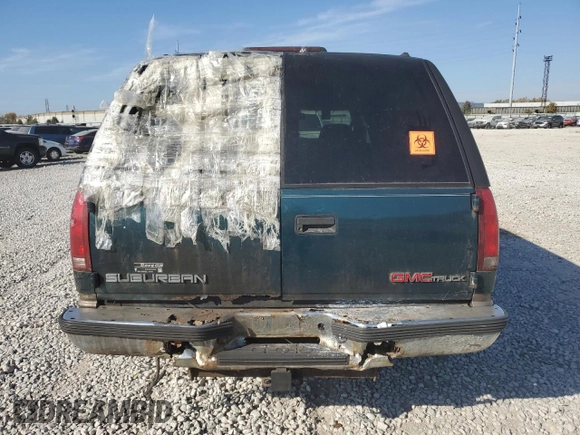 1997 GMC Suburban z VIN 3GKFK16R7VG514905, wystawiony jako Copart lot #77410934 z przebiegiem 193 116 mil mil oraz Szkoda całkowita • Salvage title. Historia ofert i sprzedaży dostępna na DreamBid. Obrazek 6.