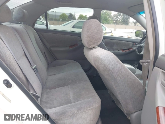 2004 Toyota Corolla CE with VIN JTDBR32E440052035, listed as a IAAI auction lot 42218301 with 299,999 mi miles. Bid and sale history available at carsss.com. Image 8.