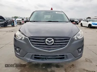 2016 Mazda CX-5 Touring z VIN JM3KE2CY7G0654292, wystawiony jako Copart lot #53433745 z przebiegiem 168 273 mil mil oraz Szkoda całkowita • Salvage title. Historia ofert i sprzedaży dostępna na DreamBid. Obrazek 5.