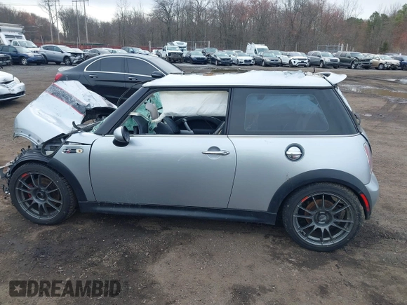 2006 MINI Hardtop S with VIN WMWRE33546TL23876, listed as a IAAI auction lot 41858060 with 146,359 mi miles and . Bid and sale history available at DreamBid. Image 14.