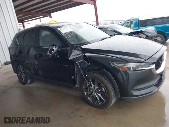 2021 Mazda CX-5 Signature with VIN JM3KFBEY5M0432033, listed as a IAAI auction lot 41607215 with 49,870 mi miles. Bid and sale history available at carsss.com. Image 13.