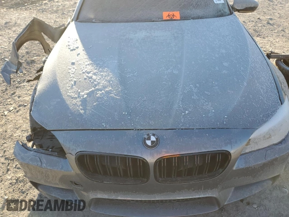 2014 BMW M5 z VIN WBSFV9C57ED593159, wystawiony jako Copart lot #87475634 z przebiegiem Nie podano mil oraz Szkody całkowita. Historia ofert i sprzedaży dostępna na DreamBid. Obrazek 12.