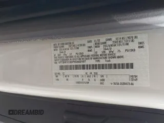 2023 Ford Transit Cargo with VIN 1FTBR1C80PKA42107, listed as a IAAI auction lot 42005312 with 80,123 mi miles. Bid and sale history available at carsss.com. Image 9.