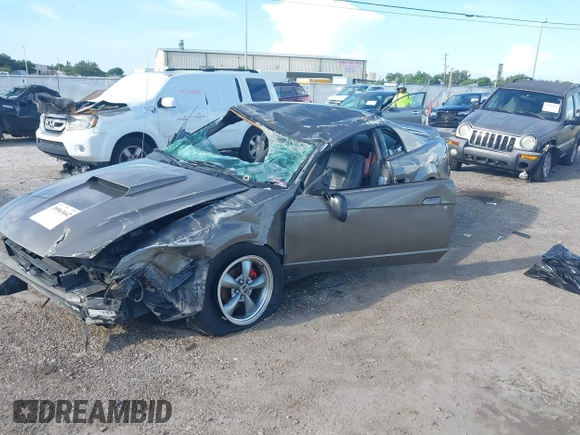 2004 Ford Mustang Standard z VIN 1FAFP40684F194867, wystawiony jako IAAI lot #39963442 z przebiegiem Nie podano mil oraz . Historia ofert i sprzedaży dostępna na DreamBid. Obrazek 2.