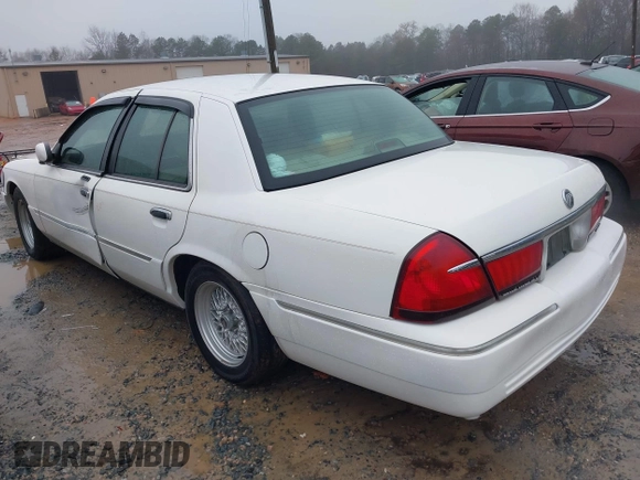 2001 Mercury Grand Marquis LS with VIN 2MEFM75W41X672360, listed as a IAAI auction lot 41418594 with 73,717 mi miles and . Bid and sale history available at DreamBid. Image 3.