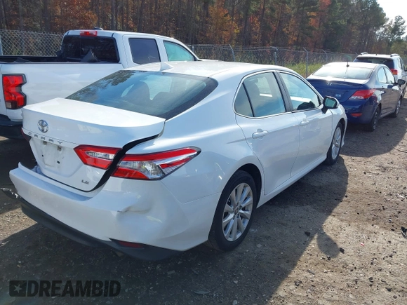 2020 Toyota Camry LE with VIN 4T1C11AKXLU986310, listed as a IAAI auction lot 40977100 with 108,208 mi miles and . Bid and sale history available at DreamBid. Image 4.