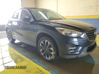 2016 Mazda CX-5 Grand Touring with VIN JM3KE4DY0G0813499, listed as a Copart auction lot 54174805 with 116,709 mi miles and Clean Title. Bid and sale history available at carsss.com. Image 4.