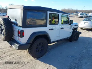 2021 Jeep Wrangler Unlimited Sport S with VIN 1C4HJXDG5MW697149, listed as a IAAI auction lot 41642386 with 71,253 mi miles. Bid and sale history available at carsss.com. Image 4.