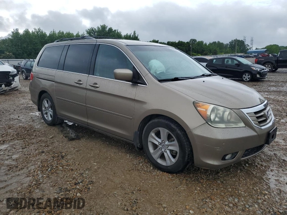 2010 Honda Odyssey Touring z VIN 5FNRL3H97AB082525, wystawiony jako Copart lot #56410845 z przebiegiem 94 819 mil mil oraz Szkoda całkowita • Salvage title. Historia ofert i sprzedaży dostępna na DreamBid. Obrazek 4.