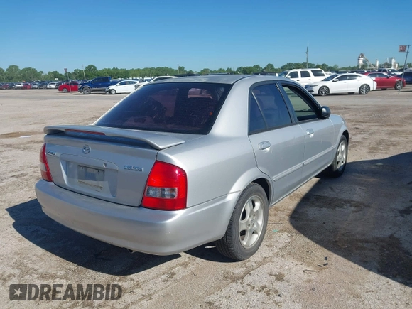 2000 Mazda Protege ES with VIN JM1BJ2213Y0284890, listed as a IAAI auction lot 42088671 with 215,104 mi miles and . Bid and sale history available at DreamBid. Image 4.
