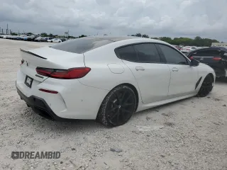 2020 BMW 8 Series M850i with VIN WBAGV8C00LCD38284, listed as a Copart auction lot 60605075 with 57,161 mi miles and Salvage title. Bid and sale history available at DreamBid. Image 3.