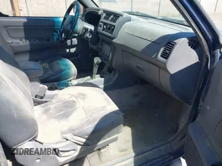 2000 Nissan Frontier XE with VIN 1N6ED27TXYC378601, listed as a IAAI auction lot 42690648 with 216,829 mi miles and . Bid and sale history available at DreamBid. Image 5.