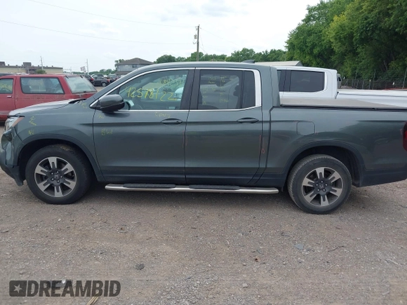 2018 Honda Ridgeline RTL-T with VIN 5FPYK3F61JB013733, listed as a IAAI auction lot 42548122 with 92,407 mi miles and . Bid and sale history available at DreamBid. Image 14.