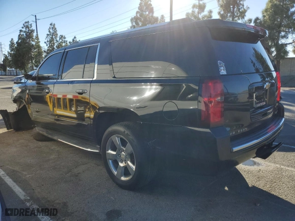 2017 Chevrolet Suburban Premier with VIN 1GNSCJKC3HR126011, listed as a Copart auction lot 87095354 with 122,437 mi miles and Clean Title. Bid and sale history available at carsss.com. Image 2.