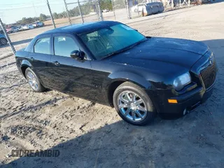 2007 Chrysler 300 C with VIN 2C3KA63H07H659653, listed as a IAAI auction lot 41088783 with 144,781 mi miles. Bid and sale history available at carsss.com. Image 1.