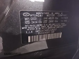 2023 Genesis G70 2.0T with VIN KMTG34TA9PU128257, listed as a Copart auction lot 75609134 with 21,969 mi miles and Salvage Title. Bid and sale history available at carsss.com. Image 12.