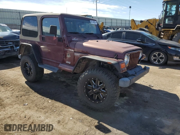 2002 Jeep Wrangler Sahara with VIN 1J4FA59S12P704608, listed as a Copart auction lot 69146504 with 125,920 mi miles and Salvage Title. Bid and sale history available at carsss.com. Image 4.