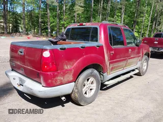 2005 Ford Explorer Sport Trac XLS z VIN 1FMZU77K95UB13467, wystawiony jako IAAI lot #42142049 z przebiegiem 164 156 mil mil oraz . Historia ofert i sprzedaży dostępna na DreamBid. Obrazek 4.