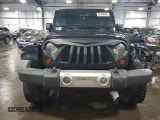 2012 Jeep Wrangler Unlimited Sahara with VIN 1C4BJWEG8CL235893, listed as a Copart auction lot 58195585 with 142,179 mi miles and Salvage title. Bid and sale history available at DreamBid. Image 5.