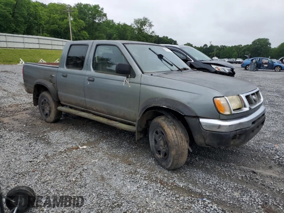 2000 Nissan Frontier XE with VIN 1N6ED27T2YC311037, listed as a Copart auction lot 57901285 with Not provided miles and Salvage title. Bid and sale history available at DreamBid. Image 4.