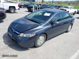 2007 Honda Civic Hybrid with VIN JHMFA362X7S027589, listed as a IAAI auction lot 42016320 with 181,110 mi miles. Bid and sale history available at carsss.com. Image 2.