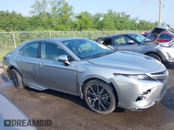 2021 Toyota Camry SE Nightshade with VIN 4T1G11AKXMU599663, listed as a IAAI auction lot 41902392 with 76,909 mi miles. Bid and sale history available at carsss.com. Image 13.