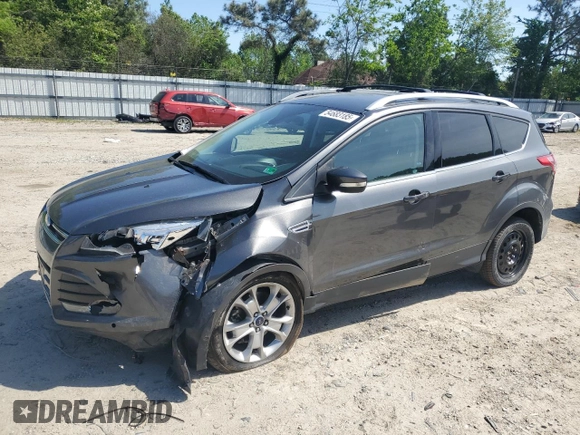 2015 Ford Escape Titanium with VIN 1FMCU9J92FUC74879, listed as a Copart auction lot 54683185 with 143,436 mi miles and Salvage title. Bid and sale history available at DreamBid. Image 1.