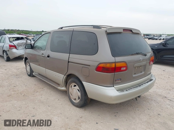 1999 Toyota Sienna LE with VIN 4T3ZF13C5XU164075, listed as a IAAI auction lot 42063741 with 93,407 mi miles. Bid and sale history available at carsss.com. Image 3.