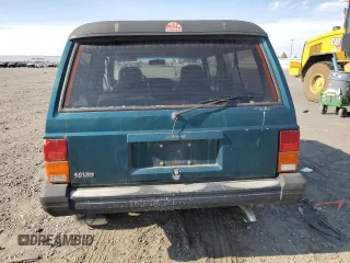 1995 Jeep Cherokee Sport with VIN 1J4FJ67S4SL519629, listed as a Copart auction lot 76107844 with 312,532 mi miles and Salvage Title. Bid and sale history available at carsss.com. Image 6.