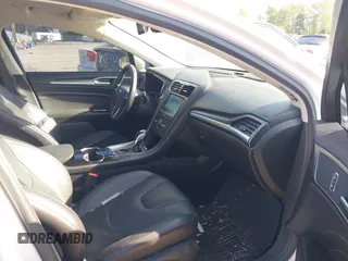 2016 Ford Fusion Titanium Hybrid with VIN 3FA6P0RU2GR357739, listed as a IAAI auction lot 42120441 with 151,201 mi miles. Bid and sale history available at carsss.com. Image 5.
