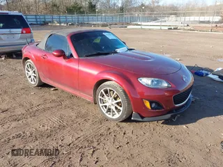 2011 Mazda MX-5 Miata Touring z VIN JM1NC2LF6B0215927, wystawiony jako IAAI lot #41419687 z przebiegiem 102 657 mil mil oraz . Historia ofert i sprzedaży dostępna na DreamBid. Obrazek 1.