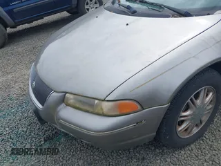1998 Chrysler Cirrus LXi z VIN 1C3EJ56H0WN300229, wystawiony jako IAAI lot #42251263 z przebiegiem 191 491 mil mil oraz . Historia ofert i sprzedaży dostępna na DreamBid. Obrazek 6.
